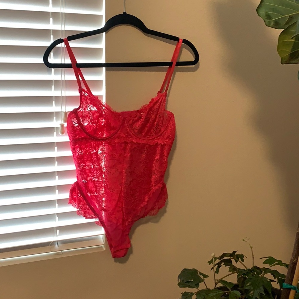 Hot pink lace bodysuit with snap closure